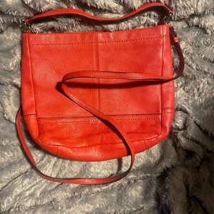 Red Coach Small -> Medium Satchel.